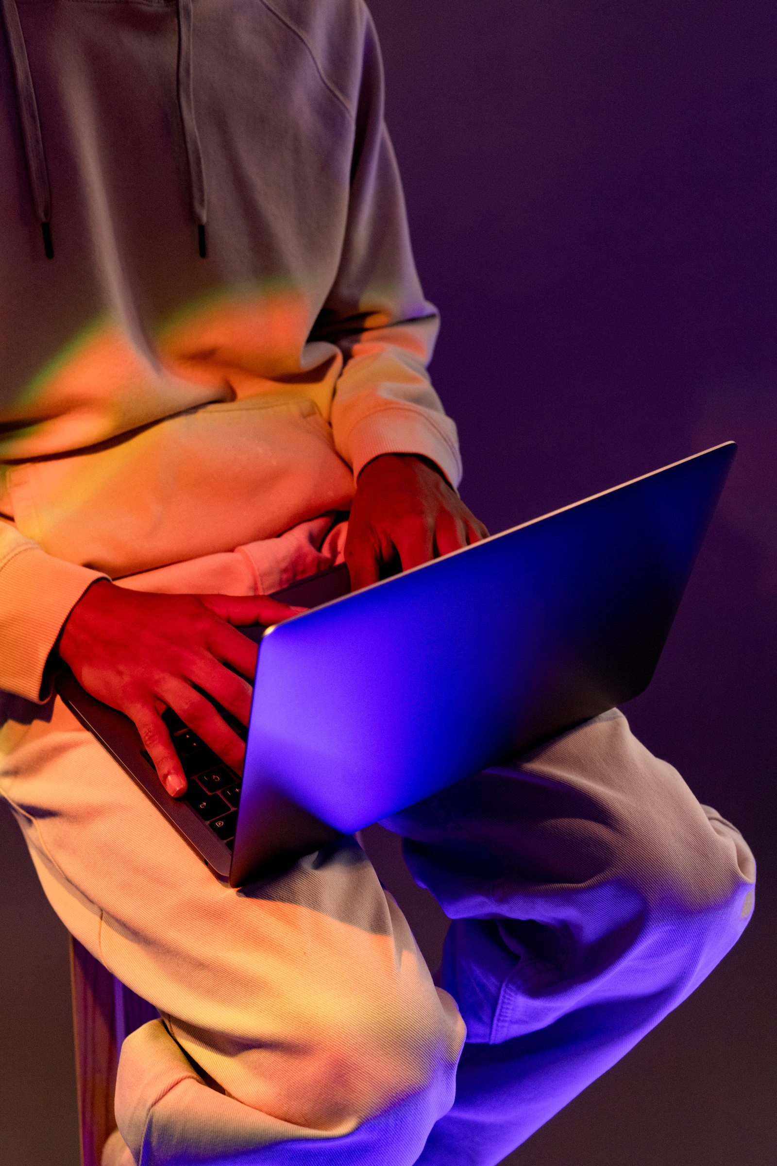 Tech Glow Person Using a Laptop
